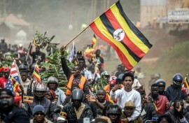 Bobi Wine supporters wave the flag at a rally this week
