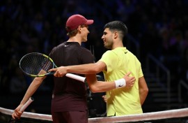 Carlos Alcaraz (R) has Jannik Sinner (L) standing in the way of a first Australian Open title