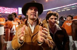 Matthew McConaughey cheers on his beloved Texas Longhorns American football team
