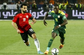 Mohamed Salah (left) and Sadio Mane playing against each other in a World Cup qualifying play-off in March 2022