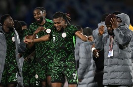 Alex Iwobi celebrates with teammates after Nigeria's AFCON quarter-final win over Algeria in Marrakesh on Saturday
