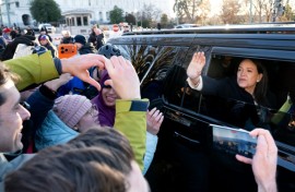 Venezuelan opposition leader Maria Corina Machado waves to supporters from her car as she departs the US Capitol after meeting with US senators on January 15, 2026