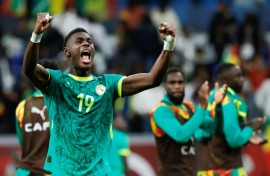 Senegal's Moussa Niakhate celebrates after the 2022 champions beat Egypt in the semi-finals