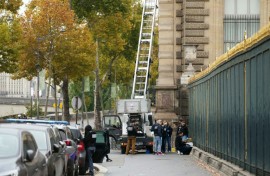 French police officers inspect a furniture elevator used by the thieves
