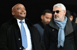 Confederation of African Football president Patrice Motsepe (L) pictured during the Africa Cup of Nations in Morocco