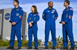 (L-R) Canadian Space Agency astronaut Jeremy Hansen, NASA astronaut Christina Koch, Victor Glover and Reid Wiseman look on during the rollout of NASA's next-generation moon rocket