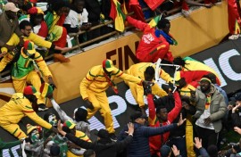 Senegal supporters clash with security forces after a penalty was awarded against their team