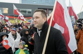 Greenland's leader Jens-Frederik Nielsen holds a Greenlandic flag as he attends a demonstration to the US consulate in Nuuk, Greenland over the weekend, as Greenlanders admit they cannot fight the United States but have no wish to be part of it