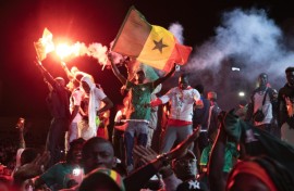 Football supporters celebrate at a 'fan zone' in Dakar on Sunday after Senegal won the Africa Cup of Nations final