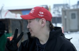 Greenlander Aqqalu Petersen wears his 'Make America Go Away' hat with pride