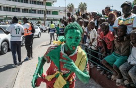 Senegal football supporters lined the route of the victory parade while others dashed to find a good vantage point