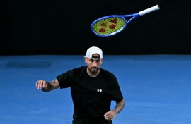 Australia's Nick Kyrgios throws his racket during his men's doubles match on Thursday