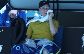 Italy’s Jannik Sinner uses ice packs between games against Eliot Spizzirri at the Australian Open