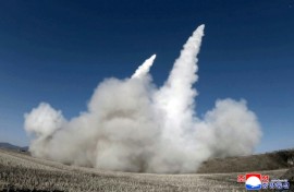 This picture taken on January 27, 2026 and released by North Korea's official Korean Central News Agency (KCNA) on January 28, 2026 shows a test firing of the renewed large-caliber rocket launcher system