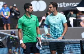 Italy’s Lorenzo Musetti (R) retired hurt in his Australian Open quarter-final against Novak Djokovic