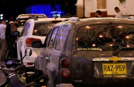 Hearses carrying the bodies some of the 15 passengers killed in the plane crash arrive at La Playa de Belen