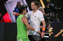 Spain's Carlos Alcaraz and Germany's Alexander Zverev embrace after their Australian Open semi-final