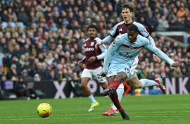 Brentford striker Dango Ouattara shoots against Aston Villa