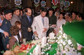 Saddam enjoying a birthday cake in 2000