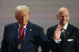 US President Donald Trump leaves the stage after receiving the FIFA peace prize
