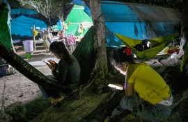 People, displaced from their homes after clashes between Thai and Cambodian soldiers, at an evacuation centre on the grounds of a pagoda in Banteay Meanchey province on February 4, 2026