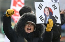 A supporter of South Korea's former president Yoon Suk Yeol in front of the Seoul Central District Court earlier this year.