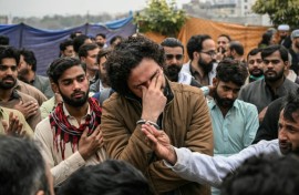 Security personnel and locals gather at the blast site inside a mosque in Islamabad