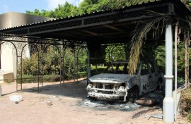 The wreckage of a car sits inside the US Embassy compound on September 12, 2012 in Benghazi, Libya, following an overnight attack on the building
