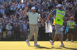 American Chris Gotterup celebrates with his caddie after beating Hideki Matsuyama in a playoff to win the PGA Tour Phoenix Open