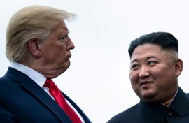 US President Donald Trump and North Korea's leader Kim Jong Un talk before a meeting in the demilitiarized zone near Panmunjom in 2019.