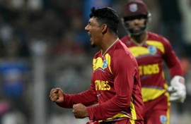 West Indies' Gudakesh Motie celebrates after taking the wicket of England's Tom Banton
