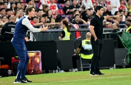 Thomas Frank (L) and Mikel Arteta (R) gesture from the touchline during a pre-season friendly between Tottenham and Arsenal in Hong Kong
