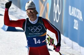 Johannes Klaebo acknowledges the crowd as the Norwegian becomes the first Winter Olympian in history to win nine gold medals