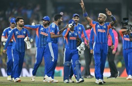 India's Hardik Pandya (R) celebrates with teammates after their win against Pakistan
