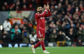 Scorer Mohamed Salah applauds Liverpool supporters after being substituted in an FA Cup victory over Brighton at Anfield.