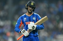 India's Abhishek Sharma walks back to the pavilion after his dismissal for a duck against Pakistan