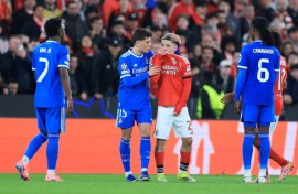 Real Madrid's Vinicius Junior (L) accused Benfica's Gianluca Prestianni (C) of calling him a 'monkey'