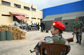 An actor dressed as a former Assad-regime soldier sits on set during the filming of an Arabic TV Series on February 17, 2026