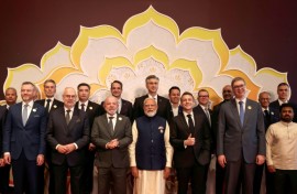 India's Prime Minister Narendra Modi (C), Brazil's President Luiz Inacio Lula da Silva (centre L) and France's President Emmanuel Macron (centre R) and other world leaders and representatives at the AI Impact Summit in New Delhi on February 19, 2026