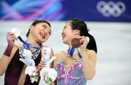 Japan's Kaori Sakamoto (L) with her Olympic figure skating silver medal and 17-year-old teammate Ami Nakai (R) with her bronze