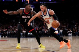 New York's Jalen Brunson drives against Dorian Finney-Smith in the Knicks' NBA win over the Houston Rockets