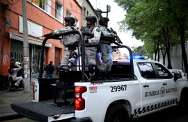 Mexico was on high alert with schools and courts closed and travelers stranded, after a powerful drug cartel's leader was killed