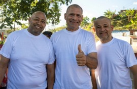 (L to R) Venezuelans Armando Fusil, Richard Corona and Robin Colina pose for a picture after being released from Rodeo I prison on Sunday