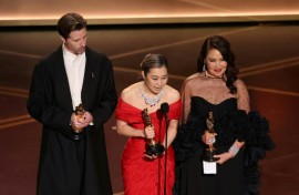 Co-director Chris Appelhans co-director Maggie Kang and producer Michelle Wong accept the Oscar for best animated feature for 'KPop Demon Hunters'