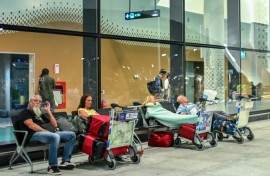 Stranded passengers wait at the Velana International Airport in Male on March 1, 2026 after the cancellation of flights destined for the Middle East