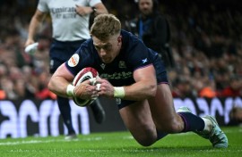 Scotland wing Kyle Steyn dives over the line to score a try during a 26-23 Six Nations win away to Wales in Cardiff