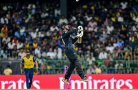 New Zealand's captain Mitchell Santner plays a shot at the World Cup