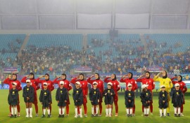 Iranian players salute during the national anthem before their AFC Women's Asian Cup match against the Philippines in Gold Coast