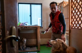 Not far from the Fukushima nuclear disaster site, former plant worker Toru Akama tends to dozens of pets abandoned after the catastrophe 15 years ago
