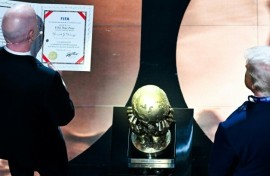 FIFA President Gianni Infantino presents the newly-created FIFA Peace Prize to US President Donald Trump at the World Cup draw
